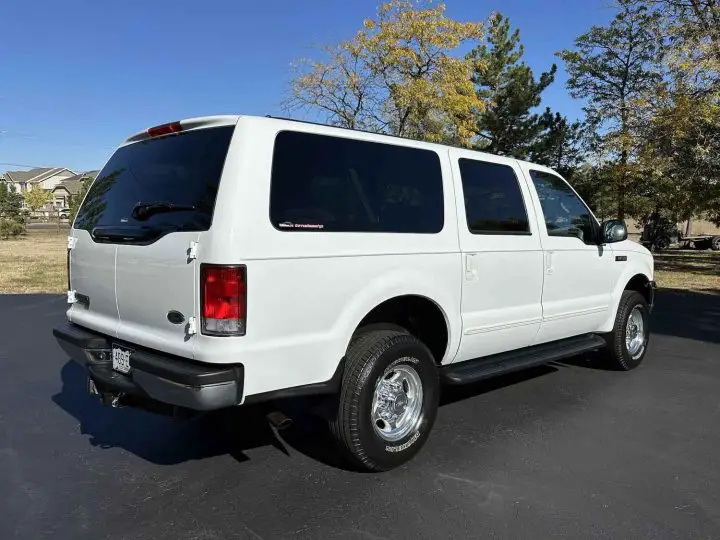 A photo showing the exterior of a 2001 Ford Excursion from a rear three quarters angle.