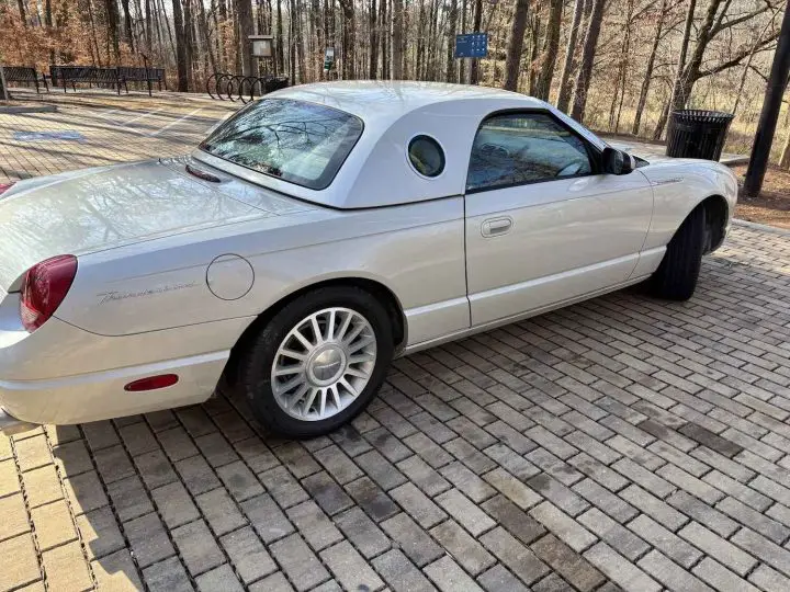 A photo showing the exterior of a 2005 Ford Thunderbird 50th Anniversary Edition from a rear three quarters view.