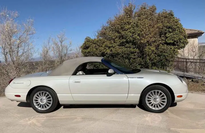 A photo showing the exterior of a 2005 Ford Thunderbird 50th Anniversary model from a side angle.