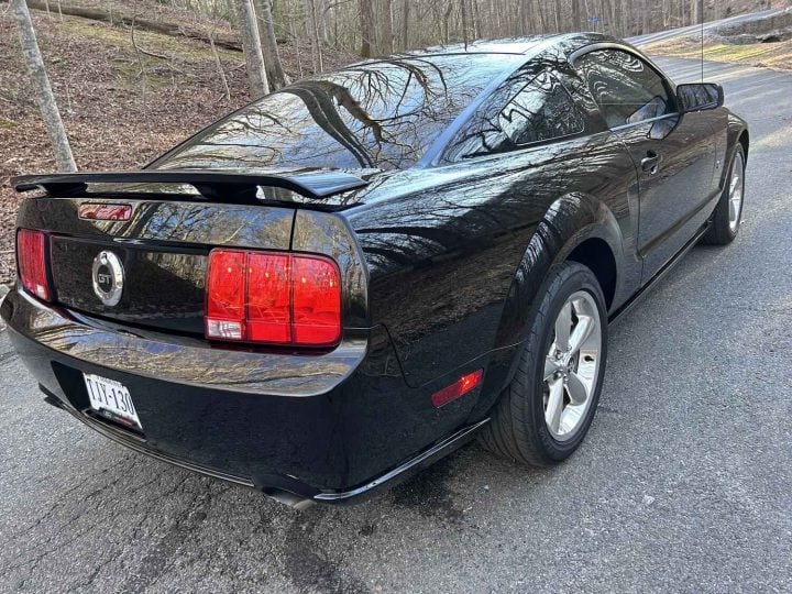 A photo showing the exterior of a 2006 Ford Mustang GT from a rear three quarters angle.