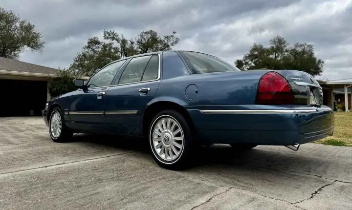 A photo showing the exterior of a 2010 Mercury Grand Marquis from a rear three quarters angle.