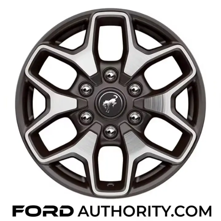 Photo of the 17-inch Machined Carbonized Gray-painted aluminum wheel, one of the four wheels offered on the 2025 Ford Bronco Badlands.