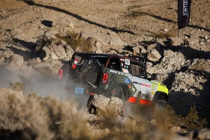 A photo showing the exterior of the Ford Bronco at the 2025 King of the Hammers from a rear three quarters angle.