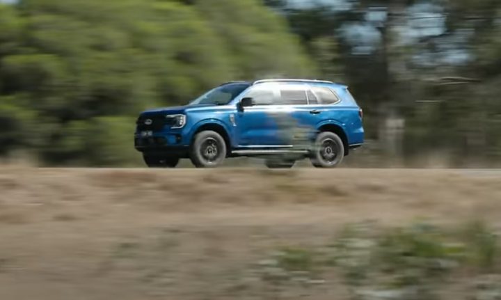 Video still of the 2025 Ford Everest during a road test, viewed from a front three-quarters angle. 