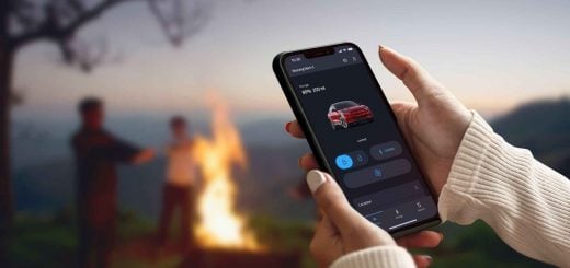 A photo showing an Apple iPhone running the FordPass app in Dark Mode.