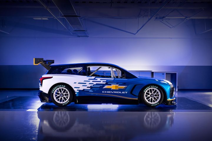 Photo showing a side view of the Chevy Blazer EV.R prototype race car, viewed from the passenger's side. This model will race against the Ford Mustang Mach-E in a potential all-electric NASCAR division.