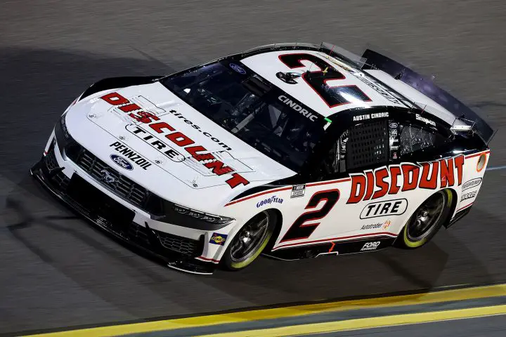 Photo of the No. 2 NASCAR Ford Mustang of Austin Cindric, shown from a front three-quarters angle while driving at Daytona. Cindric was fined for wrecking a competitor but not suspended.