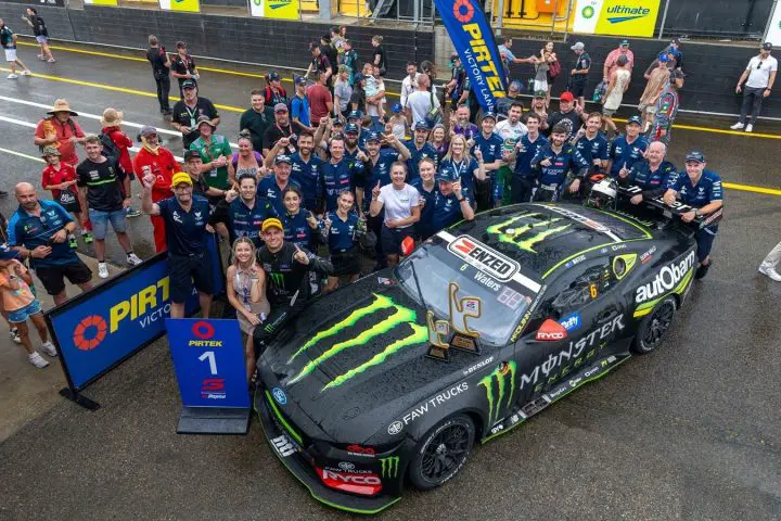 A photo showing the No. 6 Supercars Ford team gathered around Cam Waters' Ford Mustang GT. Waters won all three races in the opening round at Sydney.