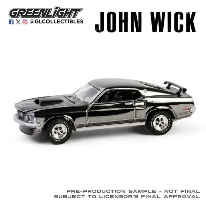 A photo showing the exterior of a John Wick 1969 Ford Mustang Mach 1 diecast model from a front three quarters angle.