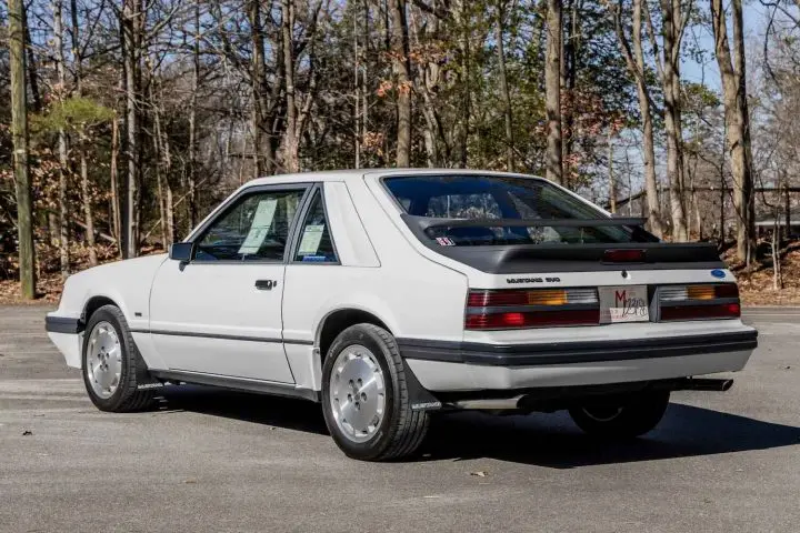 A photo showing the exterior of a 1986 Ford Mustang SVO from a rear three quarters angle.
