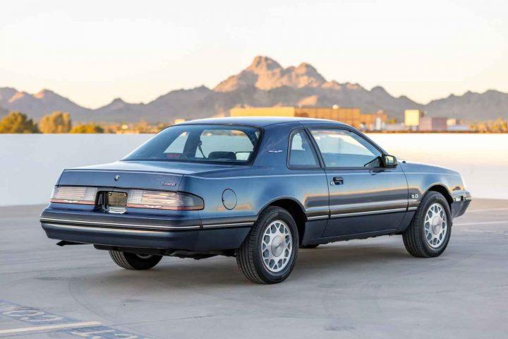 A photo showing the exterior of a 1987 Ford Thunderbird from a rear three quarters angle.