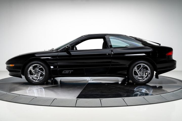 A photo showing a side view of the 1995 Ford Probe GT for sale, viewed from the driver's side. 