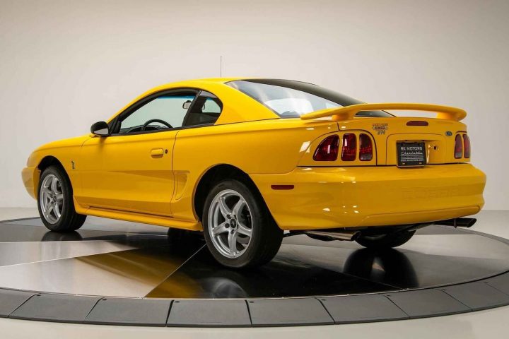 A photo showing the exterior of a 1998 Ford Mustang SVT Cobra from a rear three quarters angle.