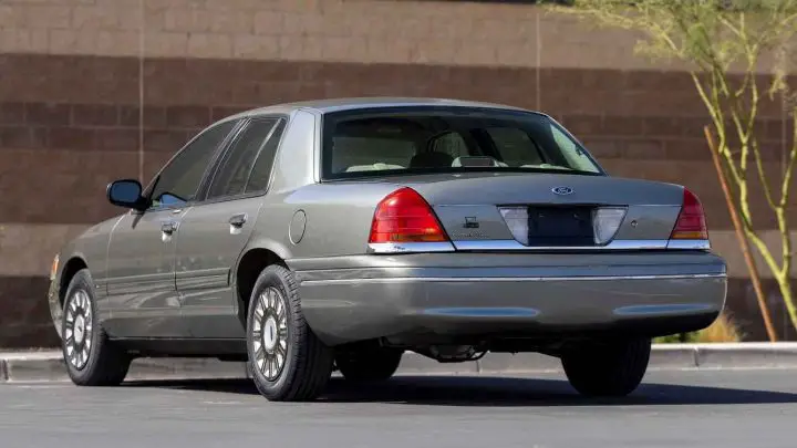 A photo showing the exterior of a 2003 Ford Crown Victoria from a rear three quarters angle.