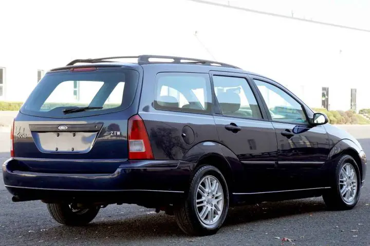A photo showing the exterior of a 2003 Ford Focus ZTW wagon from a rear three quarters angle.