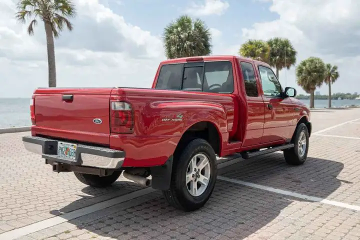 A photo showing the exterior of a 2004 Ford Ranger XLT SuperCab from a rear three quarters angle.