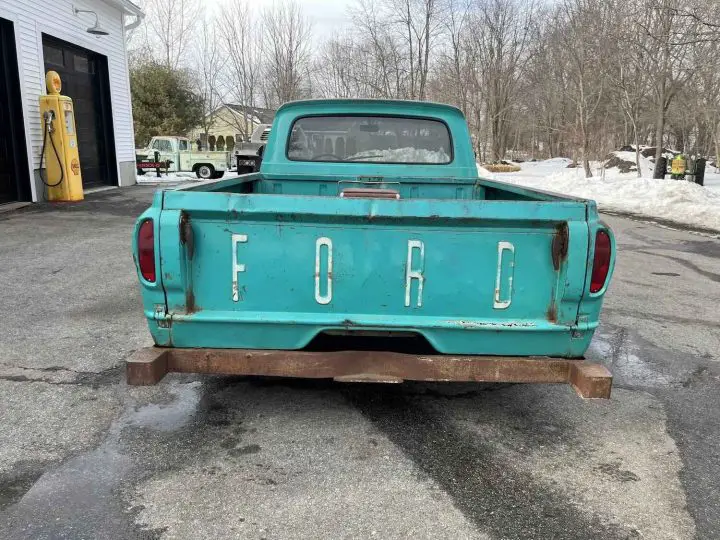 A photo showing the exterior of a 2007 Ford Crown Victoria with 1961 Ford F-100 bodywork from a rear angle.