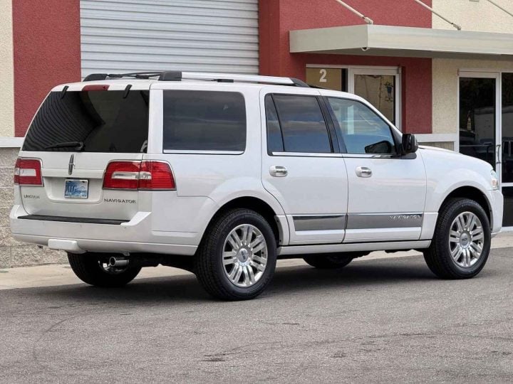 A photo showing the exterior of a 2011 Lincoln Navigator from a rear three quarters angle.