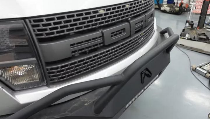 Video still of the front end of the 2013 Ford F-150 SVT Raptor with over 300K on it. It's still in impeccable shape for its age and mileage. 