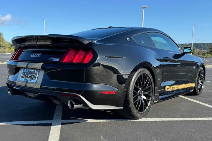 A photo showing the exterior of a 2016 Ford Mustang Shelby GT-H form a rear three quarters angle.