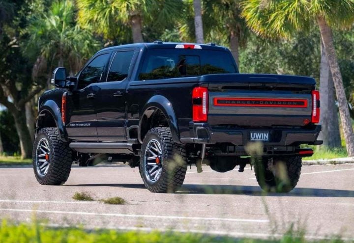 A photo showing the exterior of a Tuscany Motors 2024 Ford F-250 Harley-Davidson Edition from a rear three quarters angle.