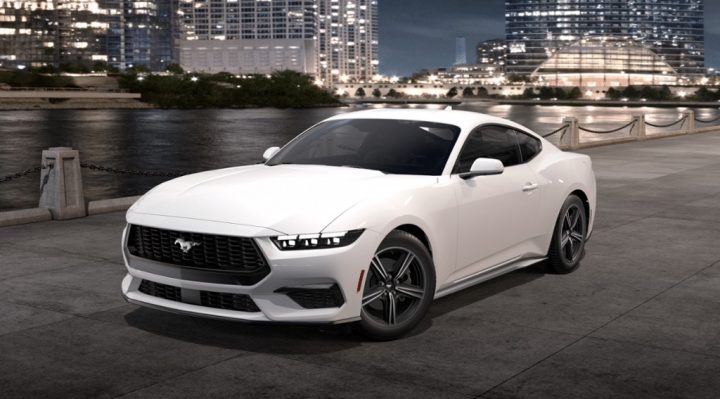 A photo of the 2025 Ford Mustang EcoBoost, shown from a front three-quarters angle. This model features the black molded-in-color grille, but there are several options available depending on trim level. 