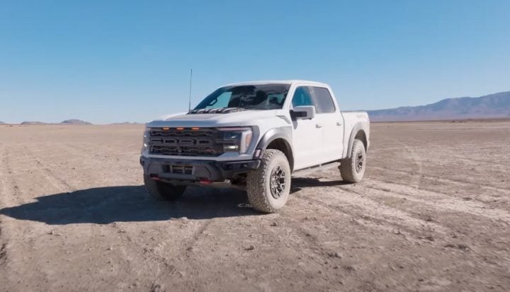 Video still of the Ford F-150 Raptor R, shown in front three quarters view. The Raptor R outperformed the Ram 1500 RHO in a recent test. 