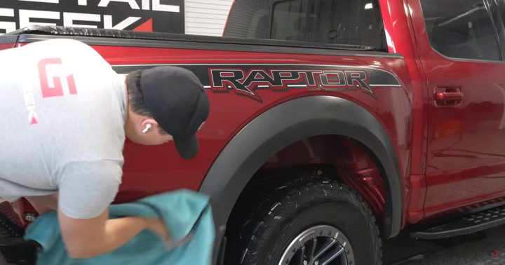 Video still of The Detail Geek cleaning his Ford F-150 Raptor by wiping down its exterior with a microfiber towel. IT hadn't been washed in over half a year.