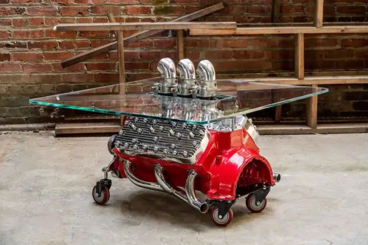 A photo showing a Ford Flathead V8 coffee table from a rear angle.