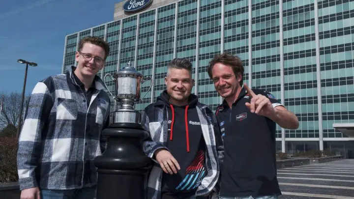 Photo of Dennis Olsen, Christopher Mies, and Frédéric Vervisch visiting Ford World HQ. The three drivers shared the winning Ford Mustang GT3 in the 2025 Rolex 24. 