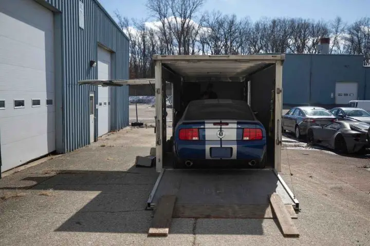A photo showing the exterior of a Ford Mustang Shelby GT500 from a rear angle.