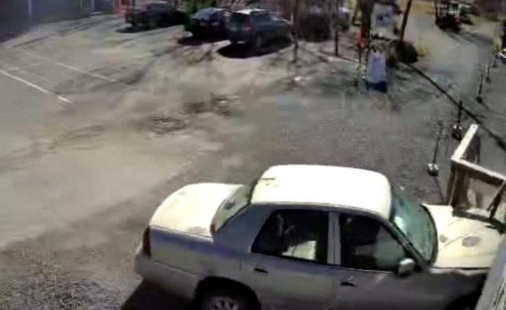Video still of the Mercury Grand Marquis as it wrecks into a restaurant after failing to slow down in a parking lot. 