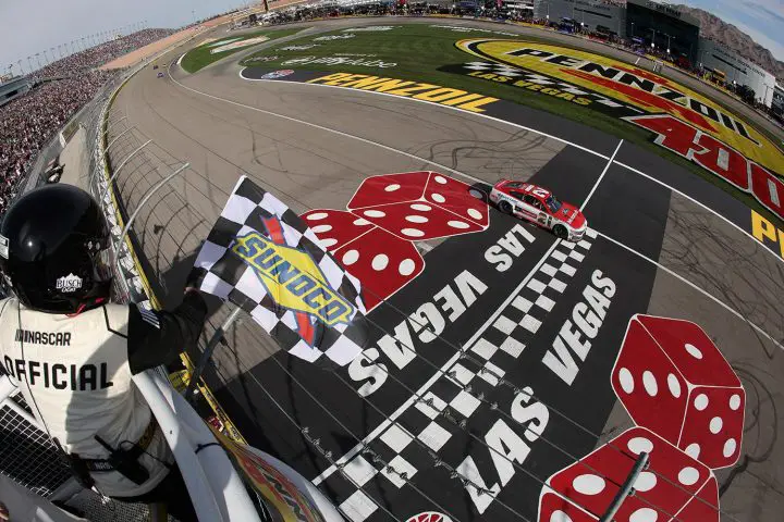 Photo of Josh Berry's No. 21 NASCAR Ford Mustang crossing the finish line at Las Vegas. The win is his first in the Cup Series. 