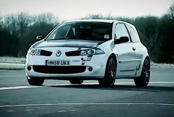 Video still of the Renault Megane R26.R on track, being raced by Top Gear against the Ford Focus RS in a classic episode rerun. 