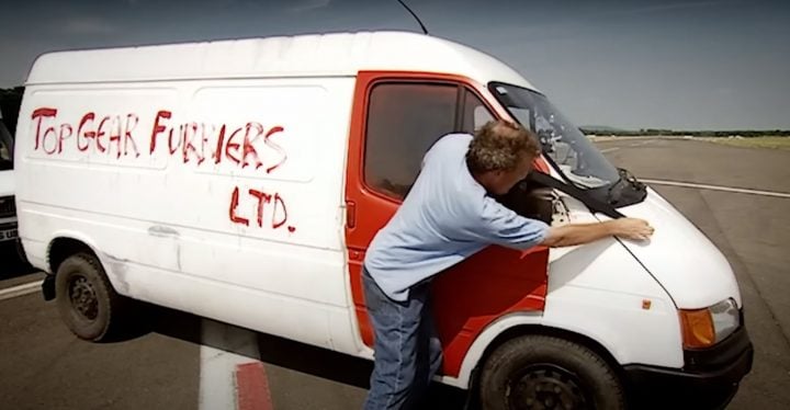 Video still of Jeremy Clarkson attempting to repair the door of his Ford Transit. Top Gear pitted it against the LLV box truck and a Suzuki Super Carry.
