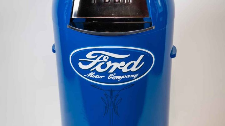 A photo of a vintage Ford service station garbage can.