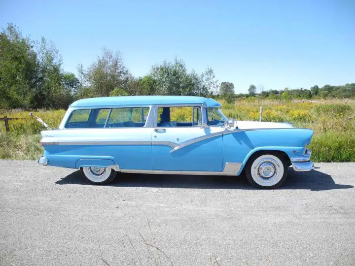 A photo showing the exterior of a 1956 Ford Parklane wagon from a side angle.