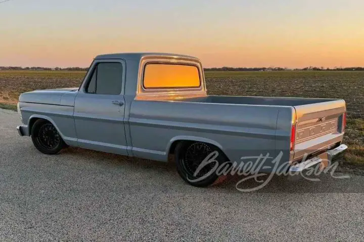 A photo showing the exterior of a 1972 Ford F-100 restomod from a rear three quarters angle.
