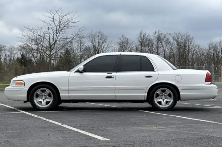 A side view of the 1999 Ford Crown Victoria currently up for sale. This model shows just 27K miles racked up. 
