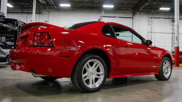 A photo showing the exterior of the 1999 Ford Mustang GT 35th Anniversary Edition from a rear three quarters angle.
