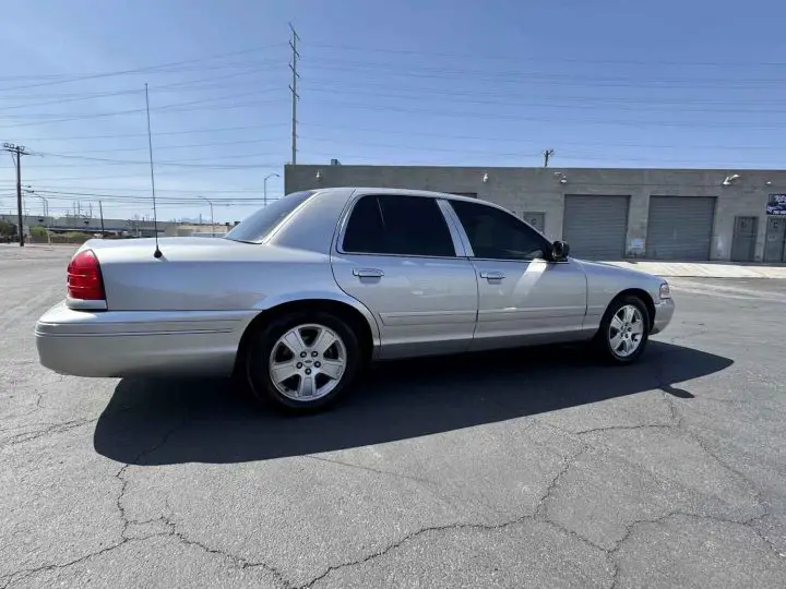 A photo showing the exterior of a 2005 Ford Crown Victoria LX Sport from a rear three quarters angle.