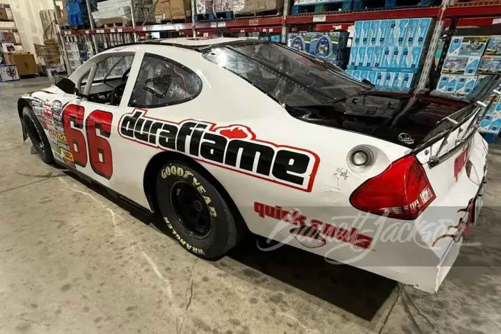 A photo showing the exterior of a 2005 Ford Taurus race car from a rear three quarters angle.