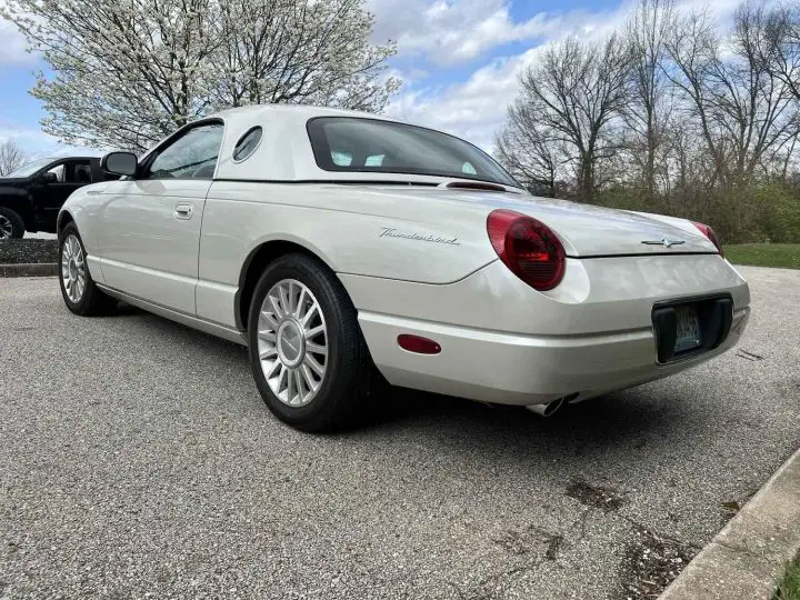 A photo showing the exterior of a 2005 Ford Thunderbird 50th Anniversary model from a rear three quarters angle.