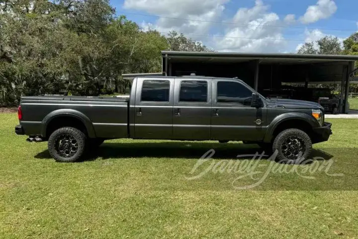 A photo showing the exterior of a 2015 Ford F-350 Super Duty six-door conversion from a side angle.