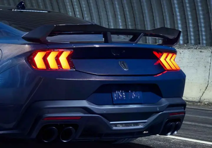 A photo showing the 2024-2025 Ford Mustang Dark Horse Performance Pack spoiler from a rear three quarters angle.