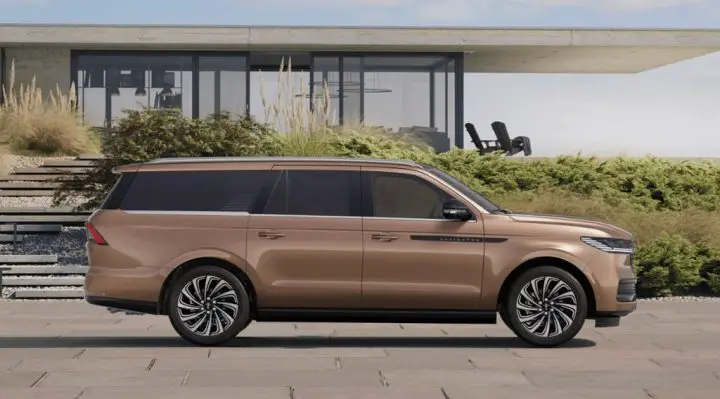 Side view of the 2025 Lincoln Navigator featuring Sunrise Copper Metallic paint. This hue is a $2,000 option exclusive to the Black Label trim. 