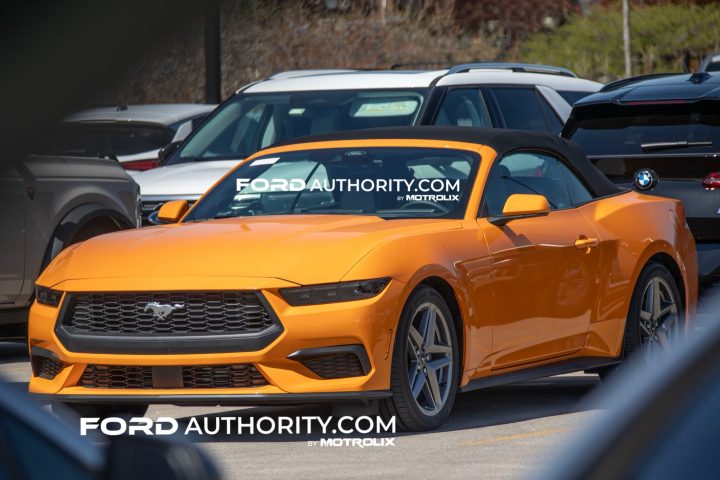 Photo showing a front three-quarters view of the 2026 Ford Mustang in Orange Fury Metallic Tricoat, a reintroduced color. 