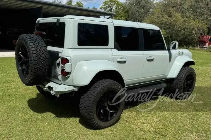 A photo showing the exterior of an Addicted Desert Designs Ford Bronco Raptor from a rear three quarters angle.