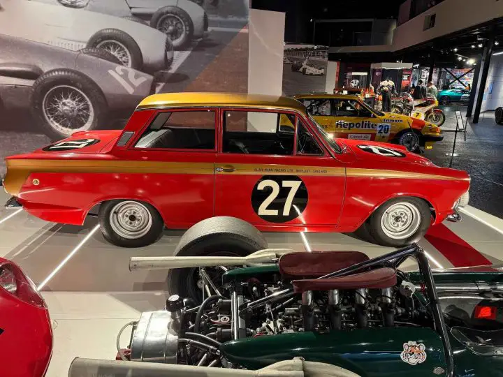 A photo showing the exterior of the Alan Mann Racing Ford Lotus Cortina from a side angle.