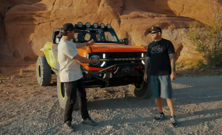 Video still of Vaugh Gittin Jr. explaining what went into the Ford Bronco 7.3L Godzilla build alongside Loren Healy. 